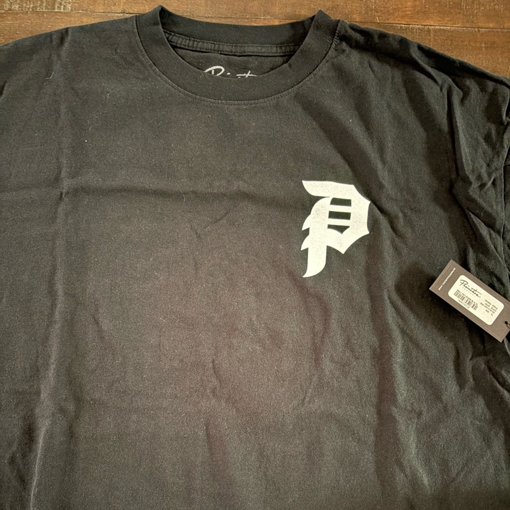 Primitive Black Tee with White Logo on front and back. Size XL, brand new